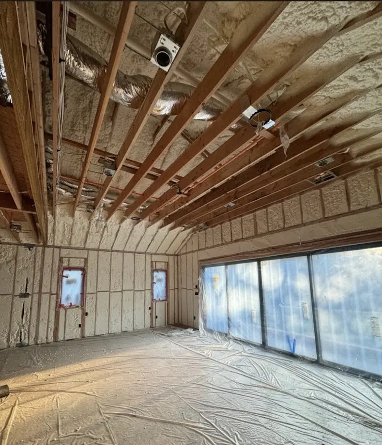 Interior walls and ceiling insulated with spray foam during new construction in Westwood Lakes